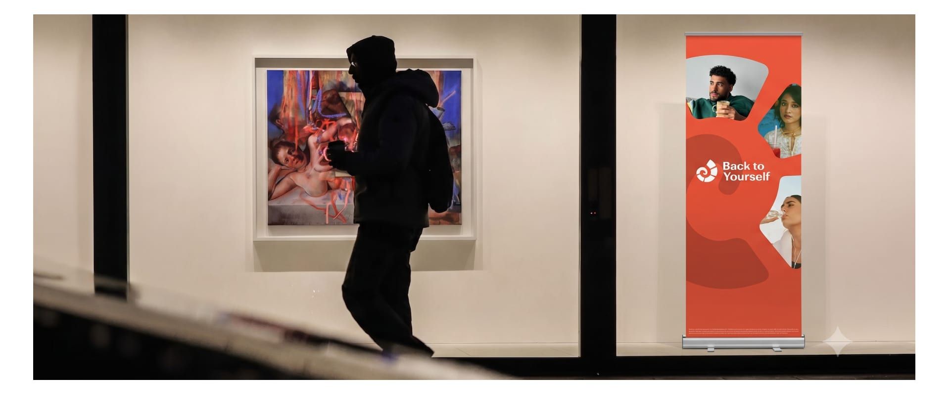 A Back to Yourself roll-up standee in an indoor space
